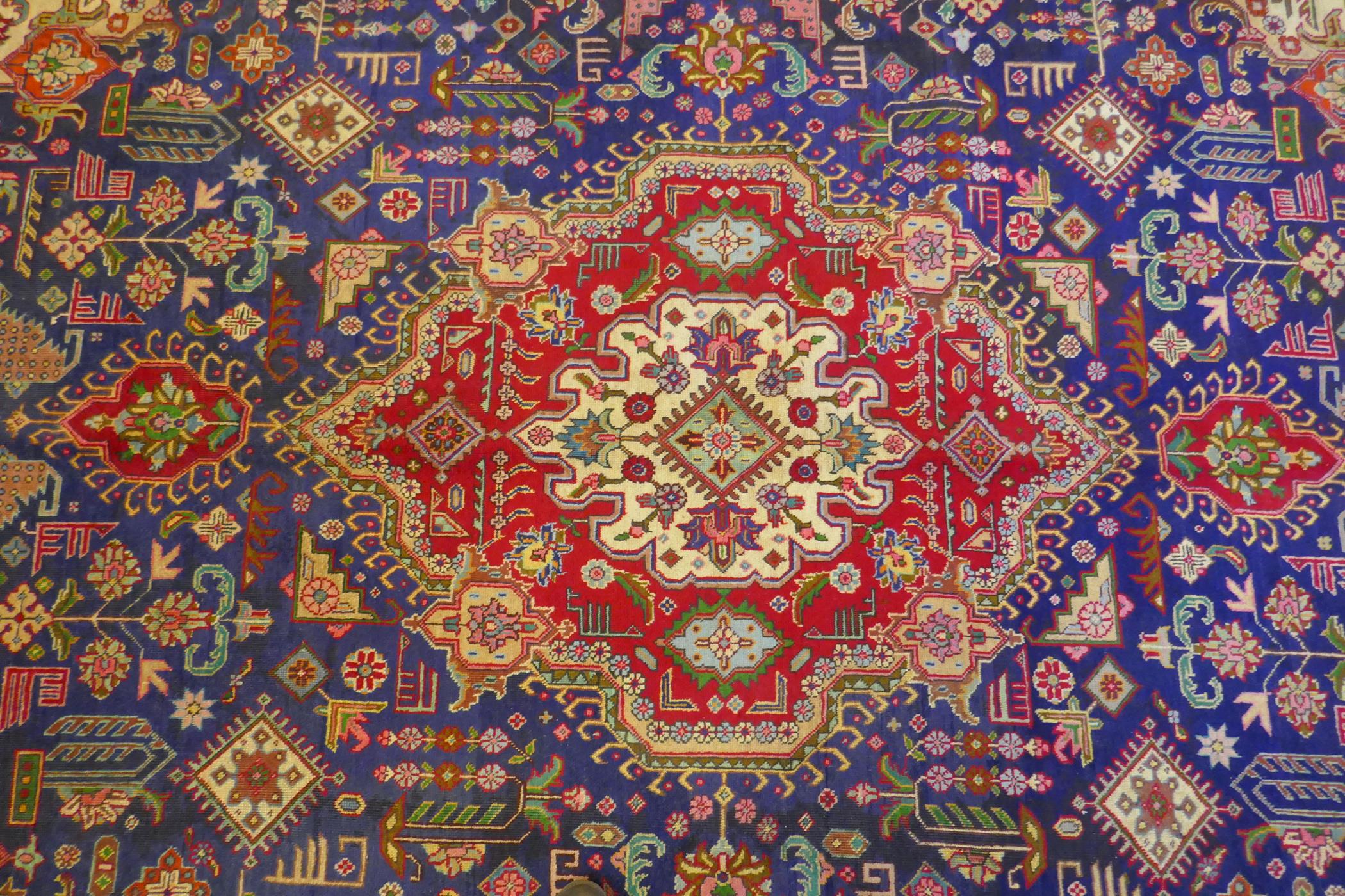 Large Persian carpet on a rich blue ground and multicolour field, with burnt orange border, - Image 5 of 6