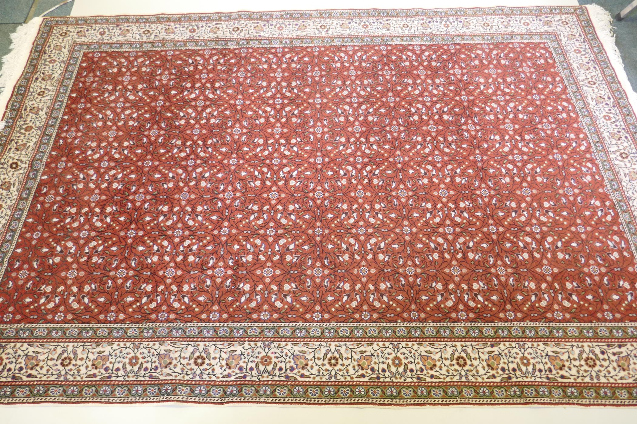 A terracotta ground wool pile Turkish Erikeh rug with all over design,200 x 290cm