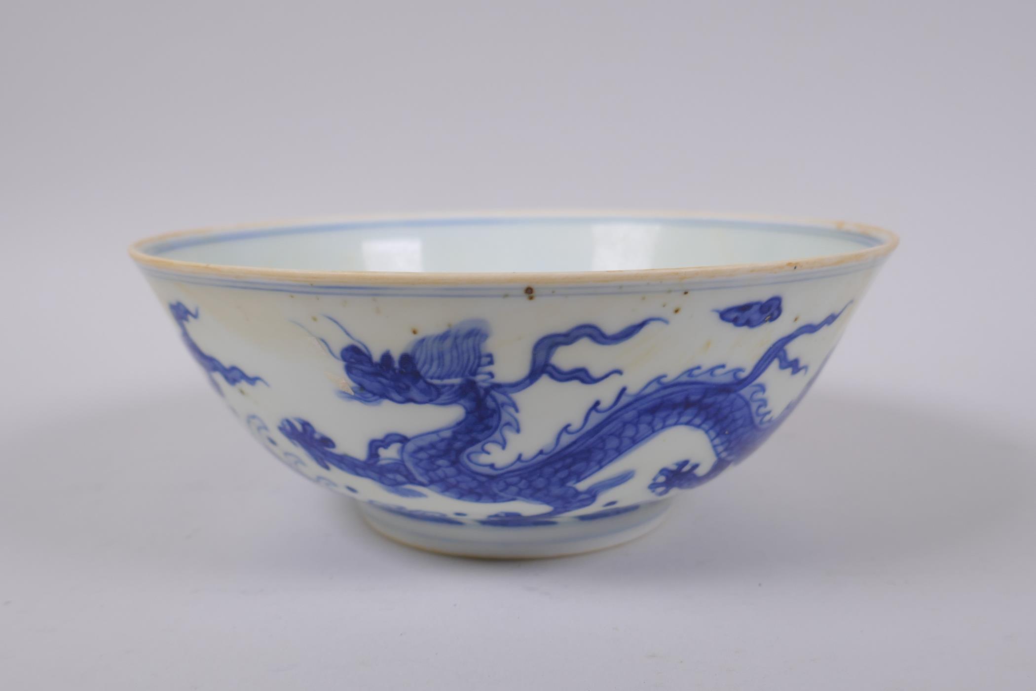A Chinese blue and white porcelain bowl with dragon decoration, Chenghua 6 character mark to base,