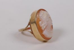 A 9ct gold dress ring, set with a cameo, Birmingham 1976, size N, gross weight 4.2g, with valuer's