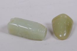A Chinese carved celadon jade pendant in the form of a pig, and another carved in the form of a