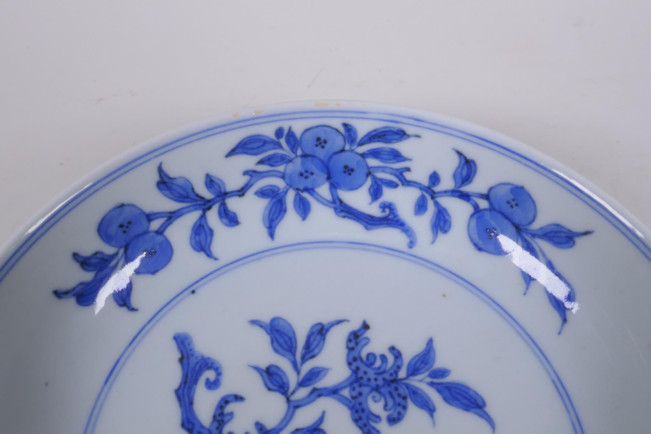 A C19th Chinese blue and white porcelain dish decorated with peaches, pomegranates and Buddha's hand - Image 3 of 5