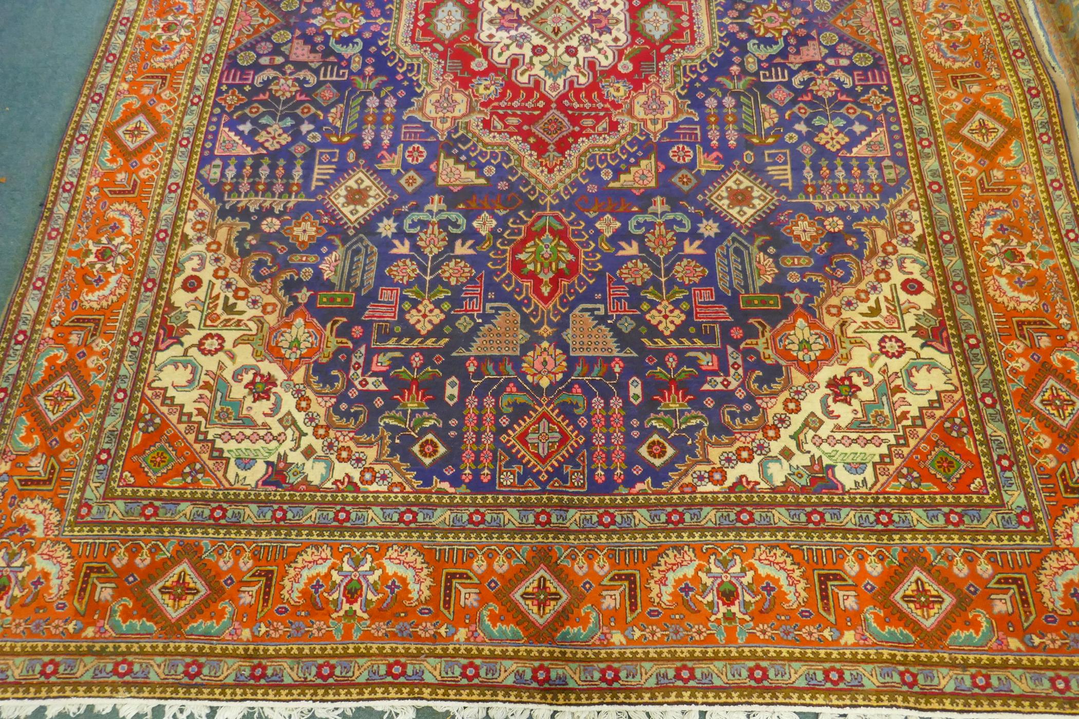 Large Persian carpet on a rich blue ground and multicolour field, with burnt orange border, - Image 3 of 6