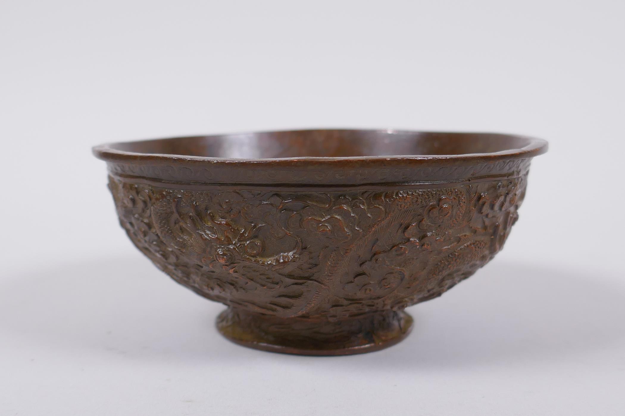A Chinese bronze trinket bowl with raised dragon decoration, Qianlong 4 character mark to base, 11cm - Image 3 of 7