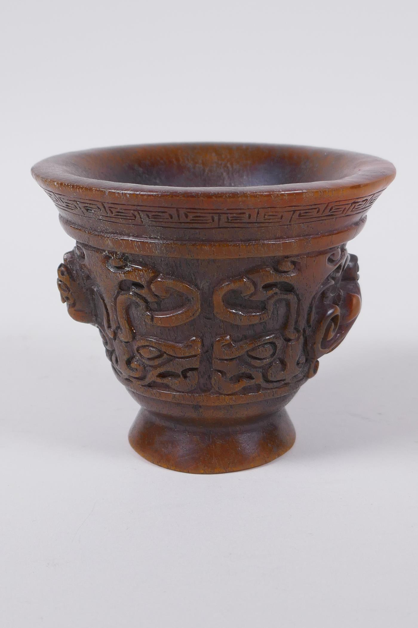 A Chinese faux horn libation cup with raised kylin decoration, seal mark to base, 8cm high x 10cm - Image 3 of 6