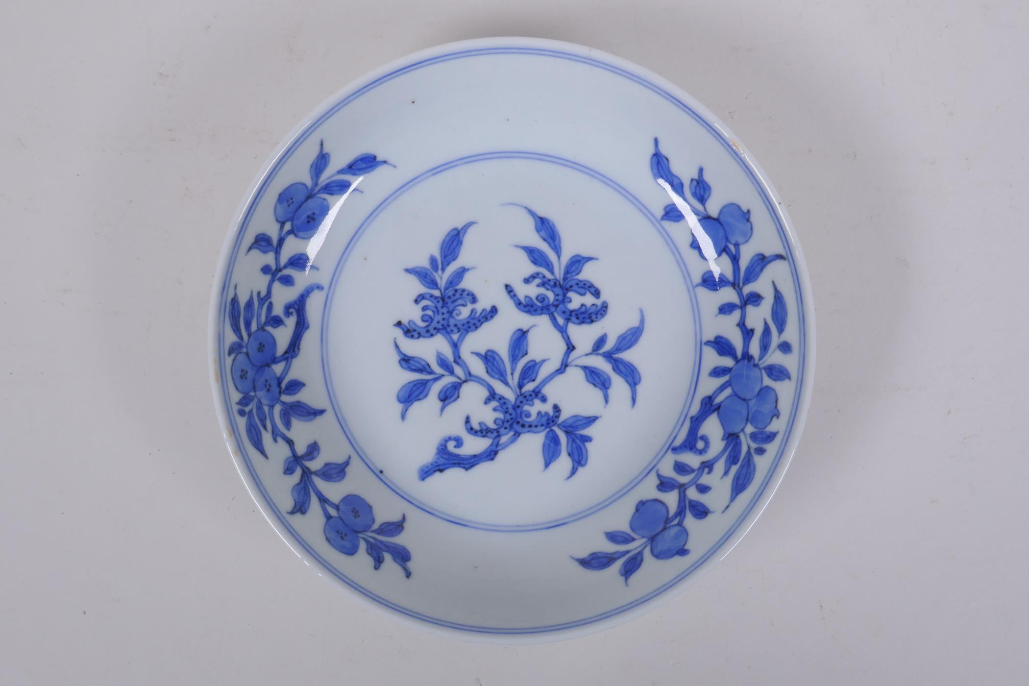 A C19th Chinese blue and white porcelain dish decorated with peaches, pomegranates and Buddha's hand