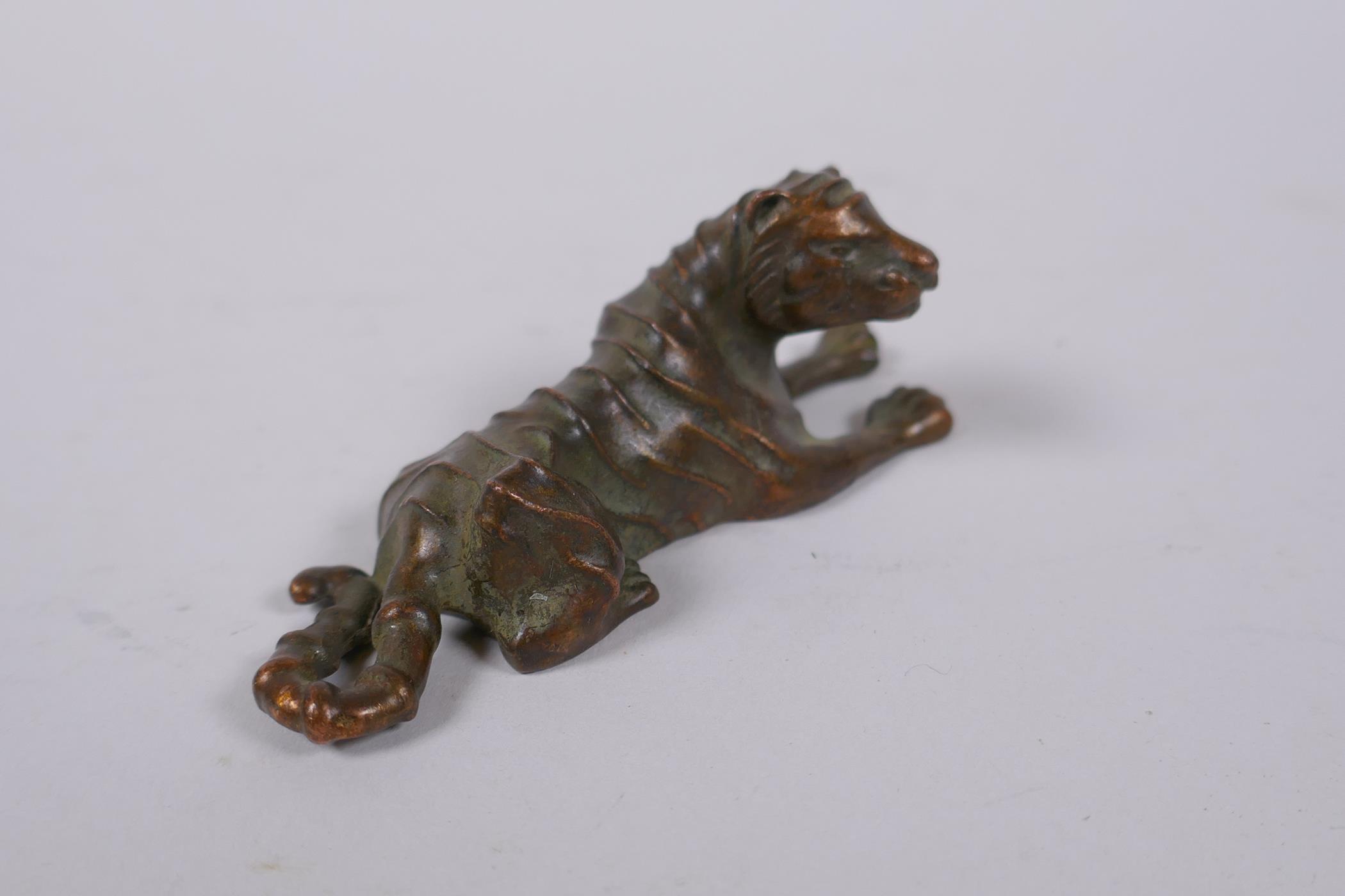 A Japanese bronze okimono tiger, mark to base, 9cm long - Image 2 of 4