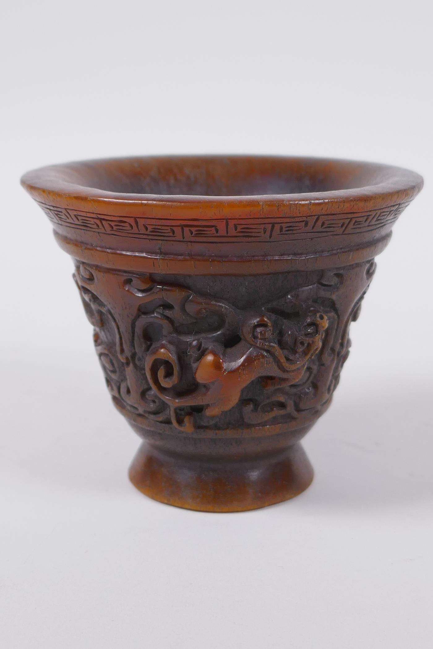 A Chinese faux horn libation cup with raised kylin decoration, seal mark to base, 8cm high x 10cm - Image 4 of 6