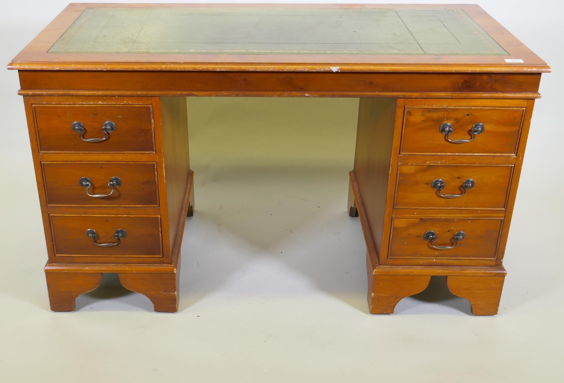 A yew wood five drawer pedestal desk with leather inset top, raised on bracket supports, 122 x 61 - Image 2 of 4