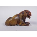 An oriental soapstone carving of a tiger, 11cm long