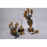 A pair of bronze and ormolu four branch candelabra in the form of urns, AF