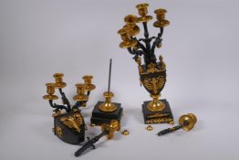 A pair of bronze and ormolu four branch candelabra in the form of urns, AF