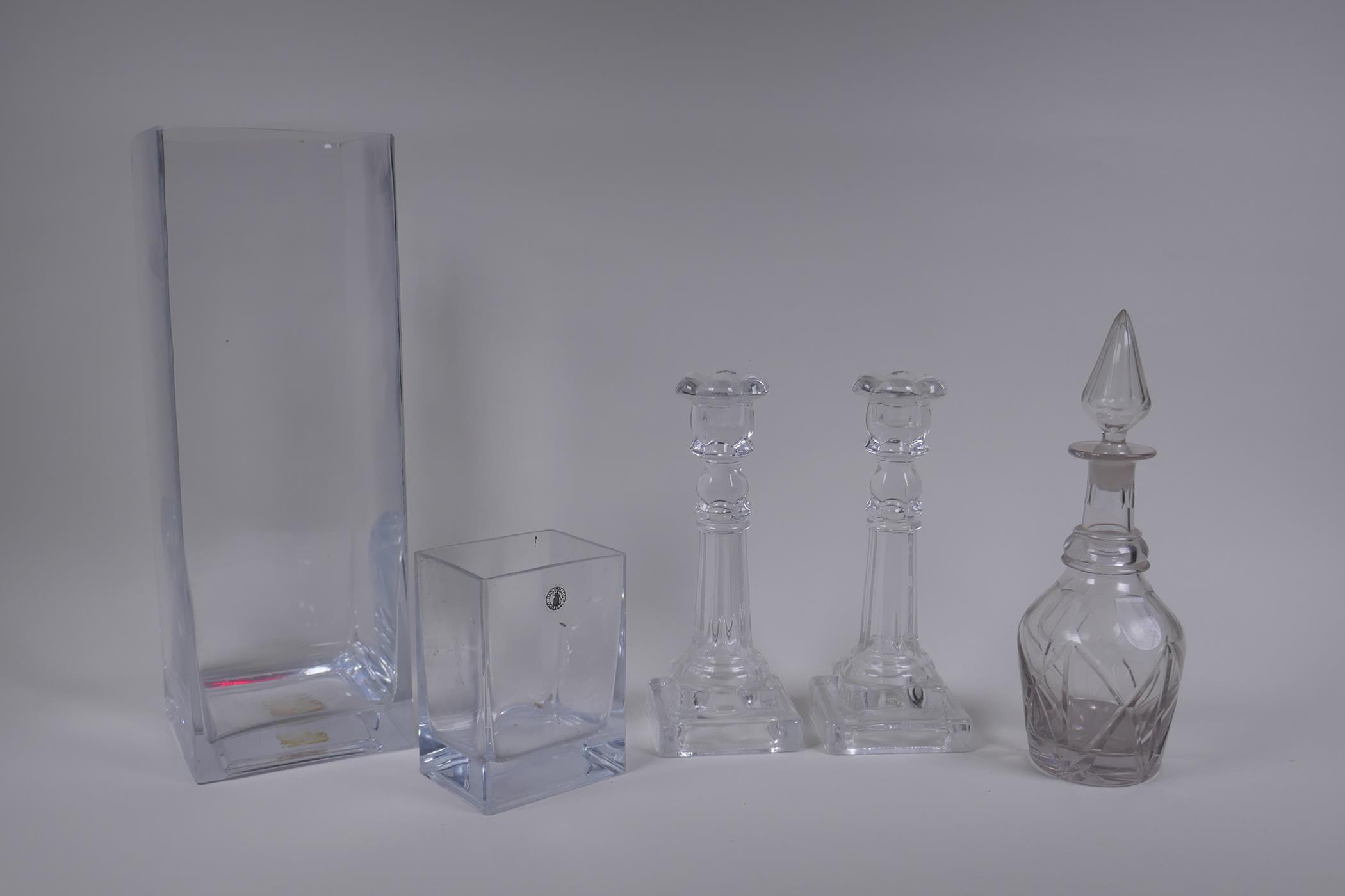 A contemporary handmade glass vase of square form and another smaller, together with a pair of