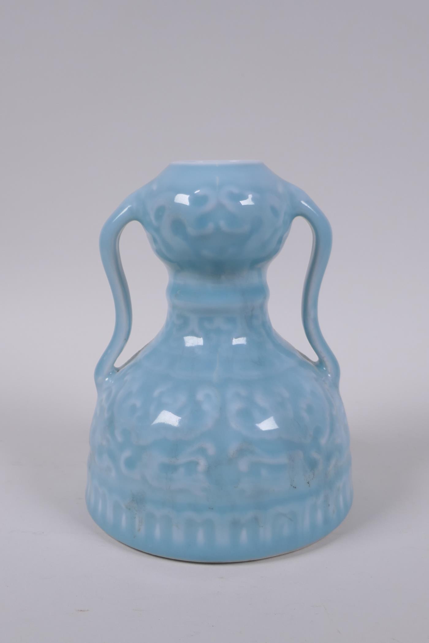 A celadon glazed porcelain two handled garlic head shaped vase with stylised under glaze dragon - Image 3 of 6