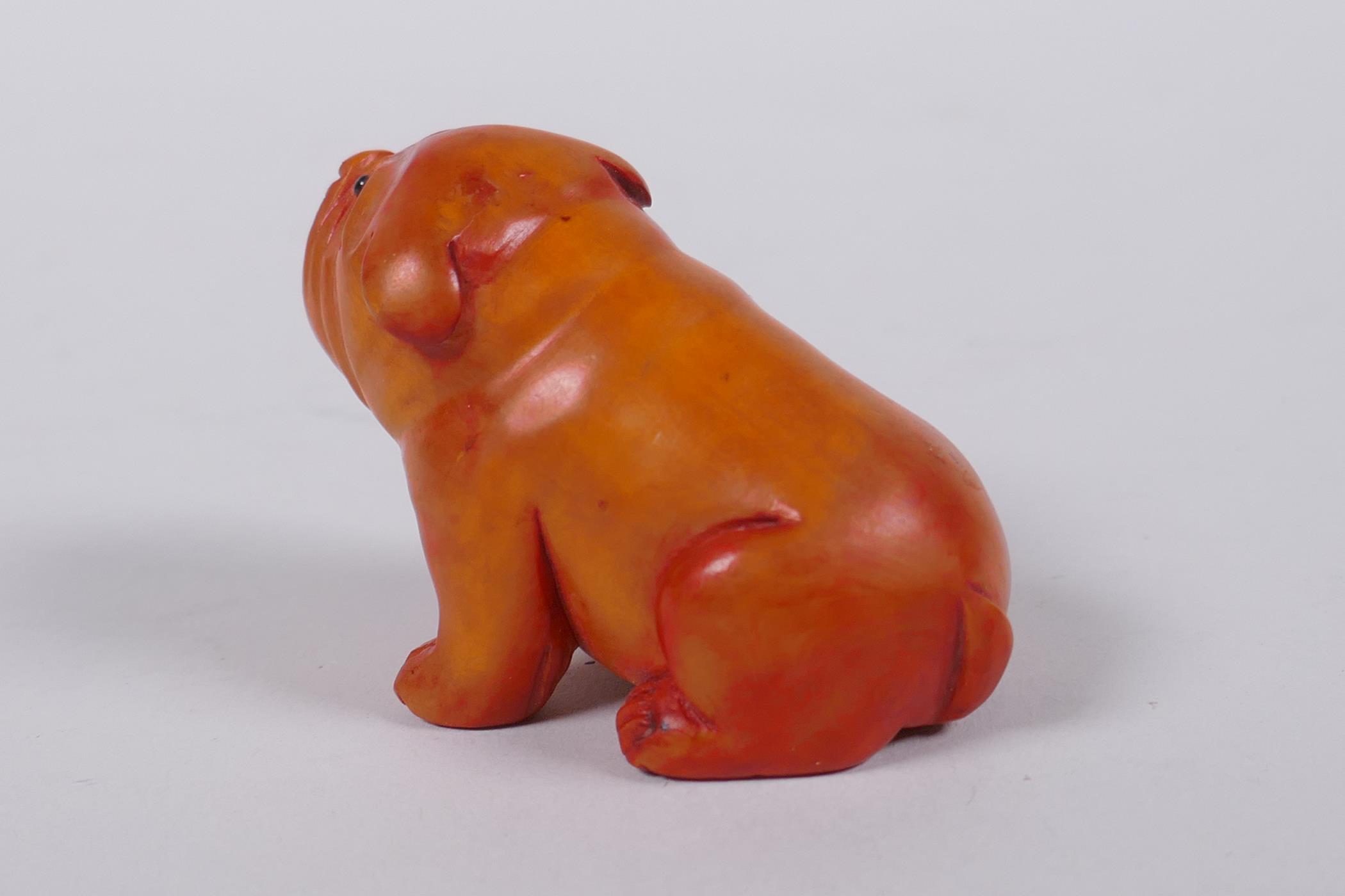 A Japanese carved boxwood netsuke in the form of a puppy, mark to base, 6cm long - Image 3 of 4