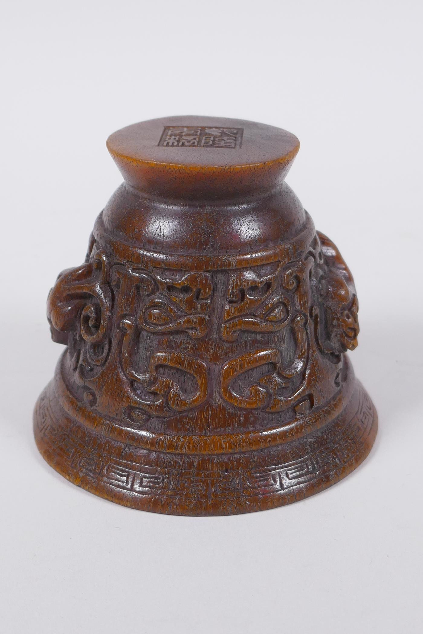 A Chinese faux horn libation cup with raised kylin decoration, seal mark to base, 8cm high x 10cm - Image 5 of 6