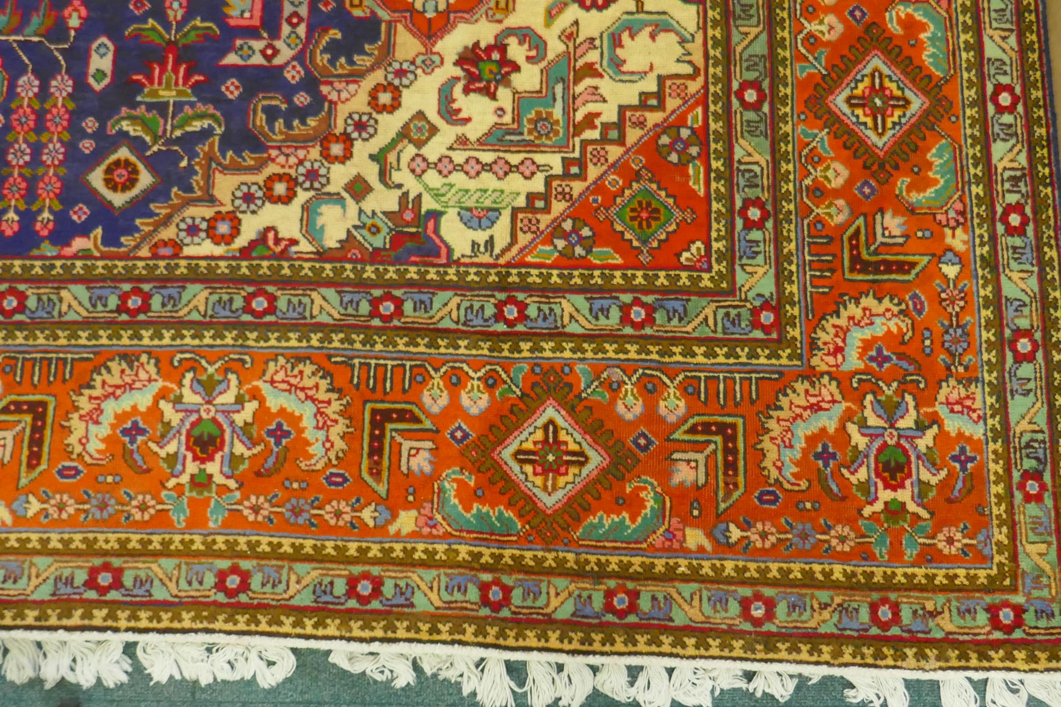 Large Persian carpet on a rich blue ground and multicolour field, with burnt orange border, - Image 4 of 6