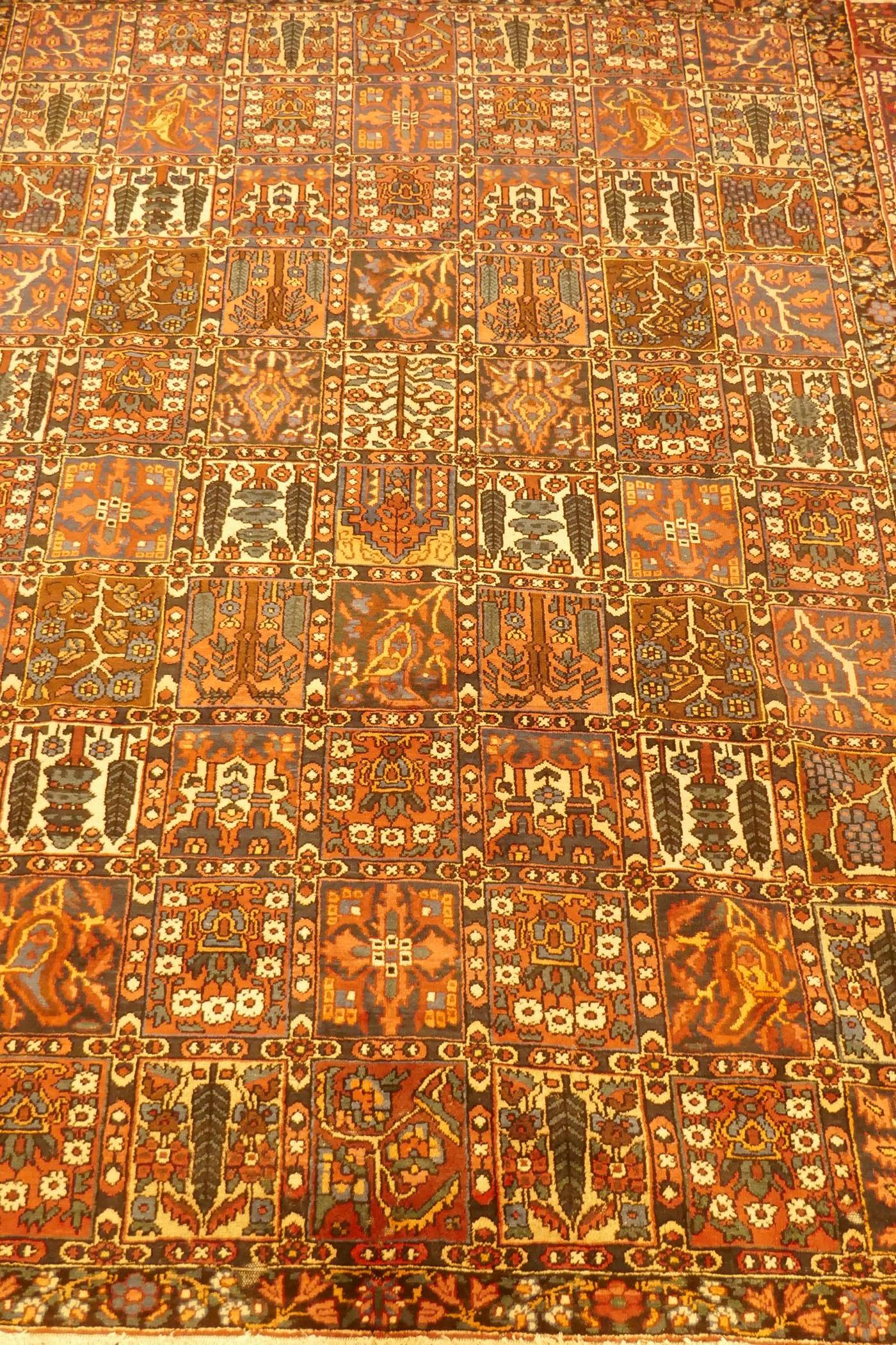 A Persian Bakhtiar multi-colour ground carpet, with Persian panel design, 335 x 250cm - Image 2 of 3