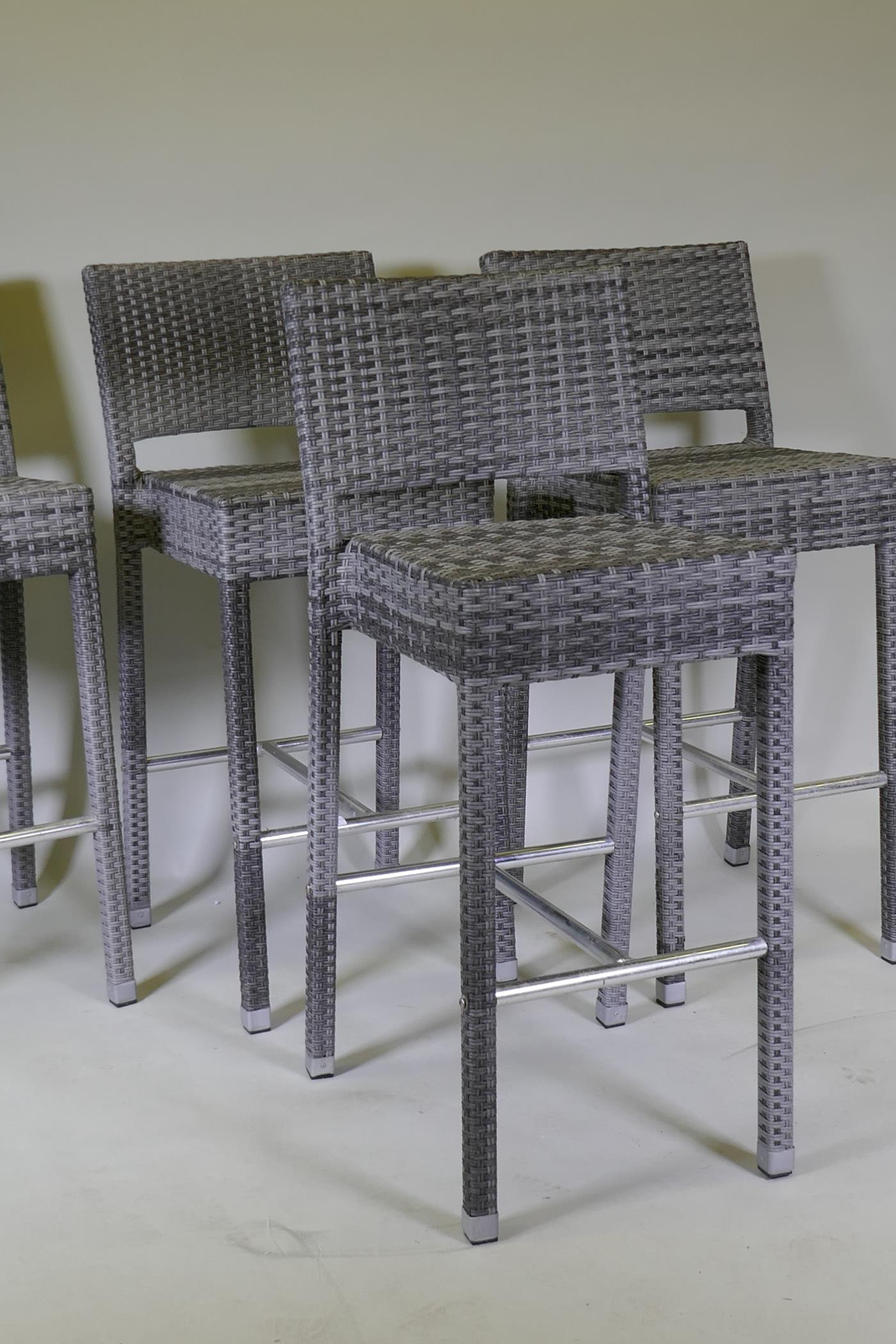 A set of four cane bar stools on chrome supports, 105cm high - Image 2 of 3