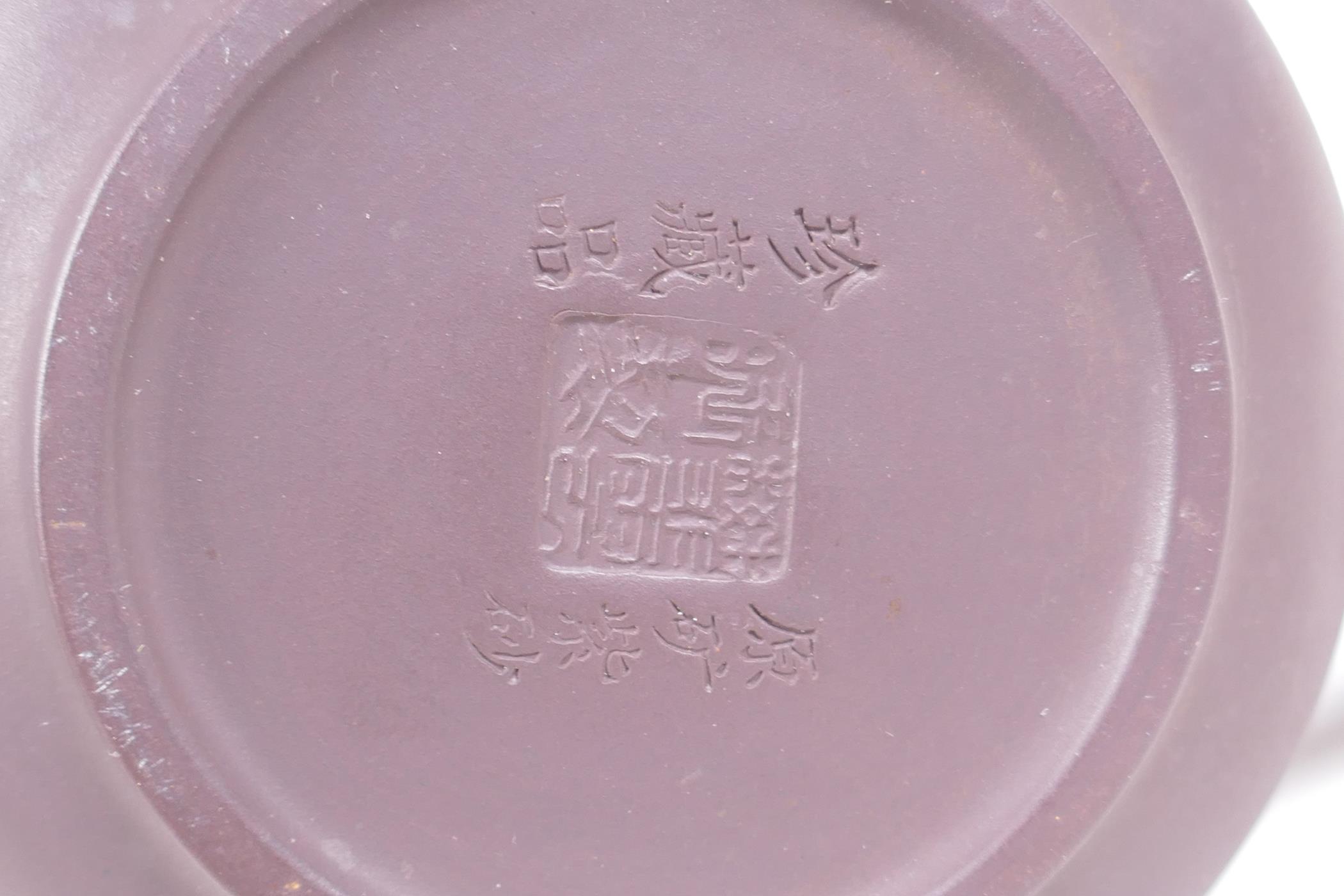 A Chinese YiXing pottery teapot decorated with a character inscription to side, impressed marks to - Image 4 of 5