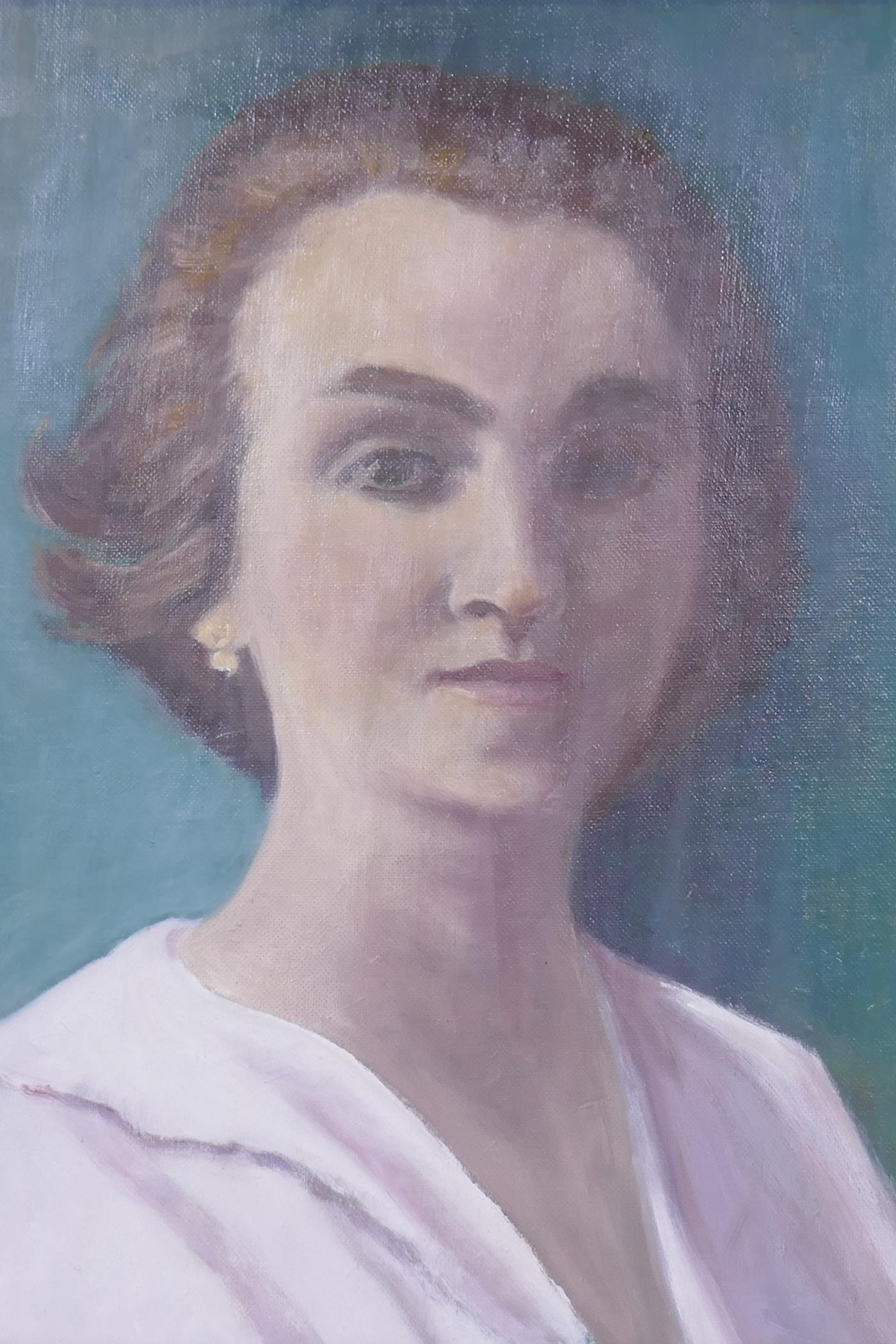 Portrait of a woman, mid C20th, oil on canvas board, unsigned, 34 x 45cm