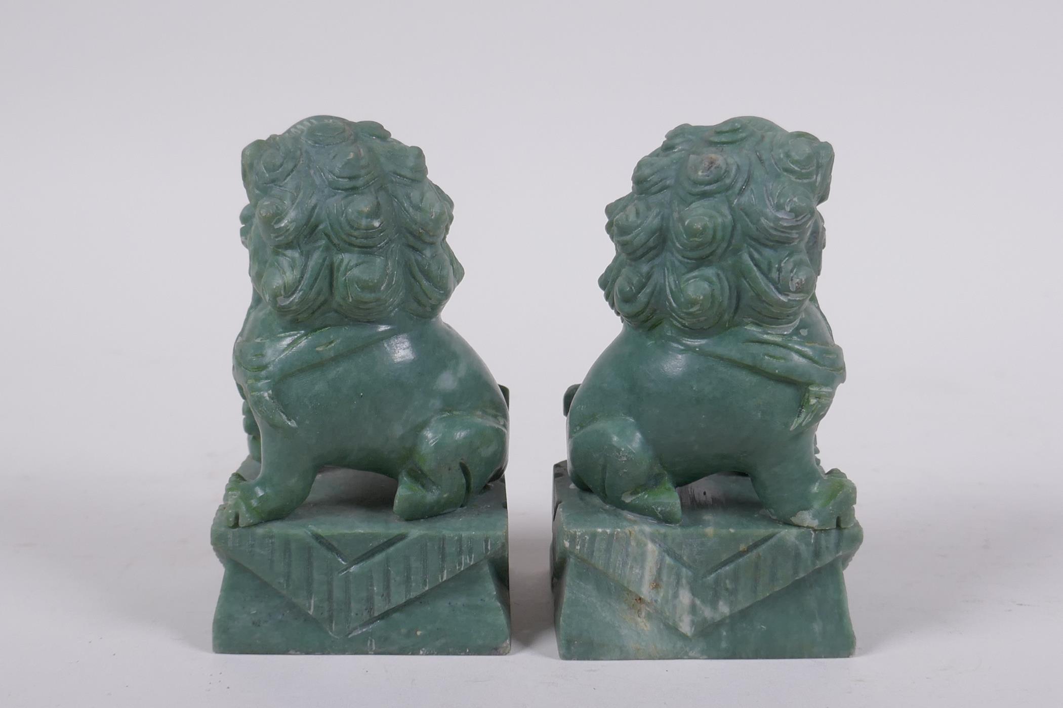 A pair of Chinese carved green soapstone temple lions, 10cm high - Image 4 of 6