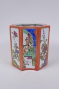 A Chinese shaped porcelain brush pot with famille vert decorative panels depicting figures and