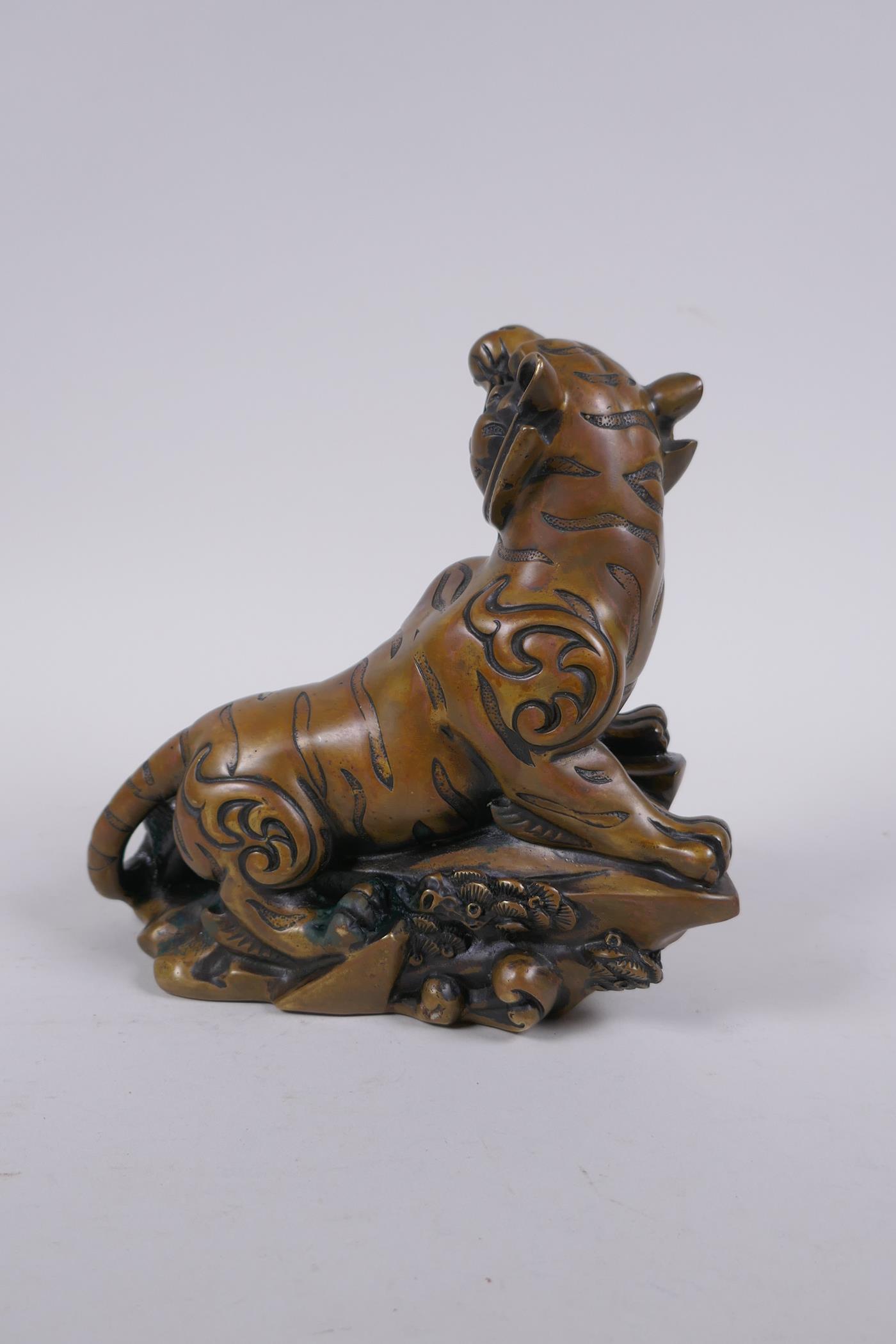 A Chinese bronze figure of a prowling tiger, 4 character inscription to side, impressed Xuande 6 - Image 3 of 7