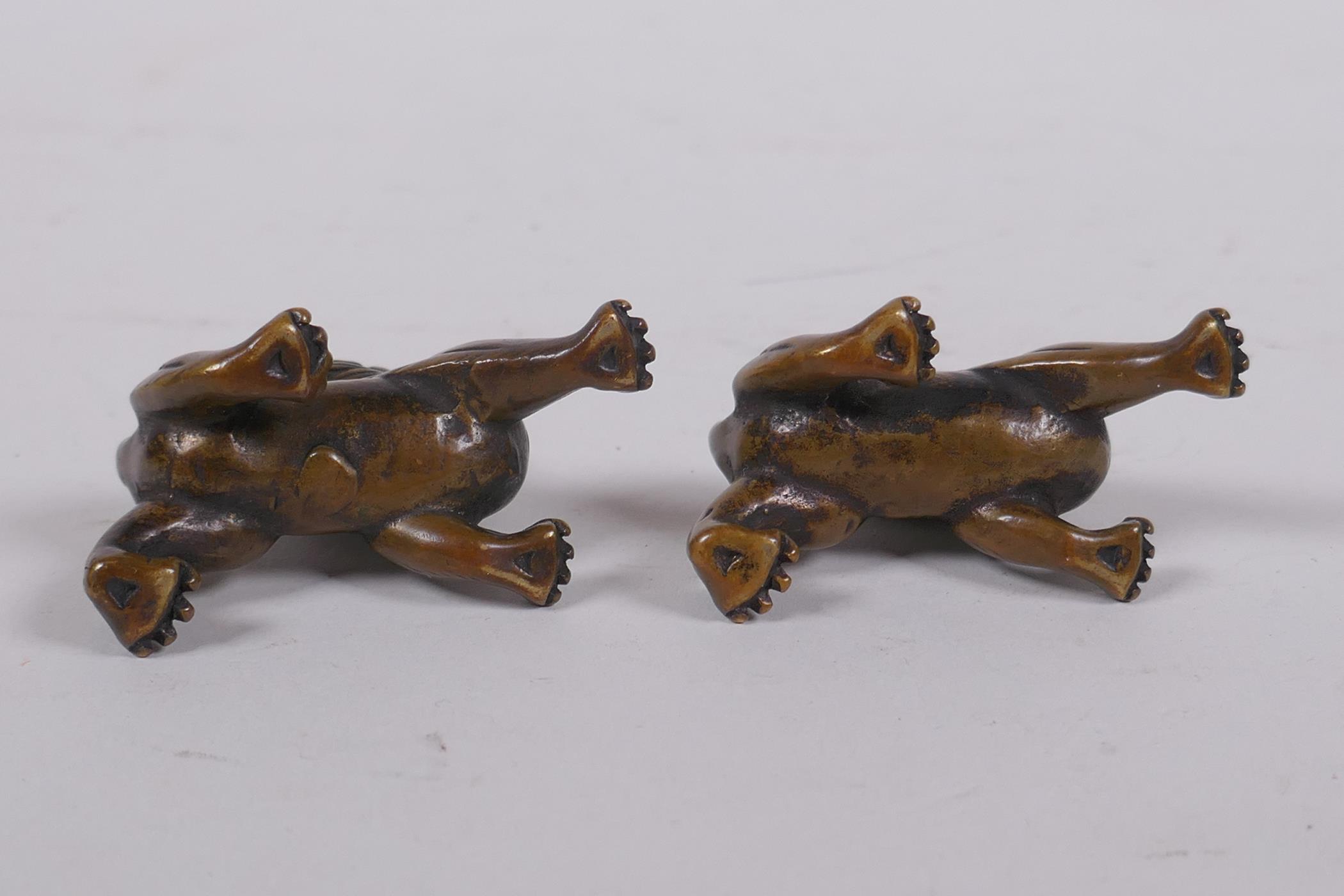 A pair of Chinese bronze kylin scroll weights, 5cm long - Image 4 of 4
