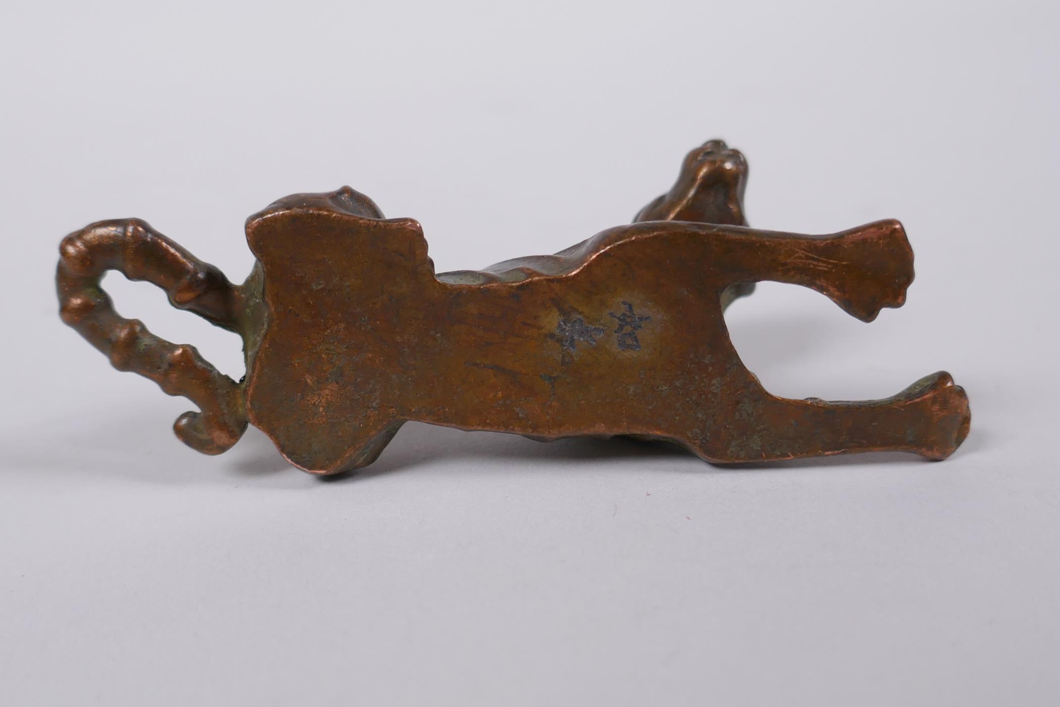 A Japanese bronze okimono tiger, mark to base, 9cm long - Image 4 of 4