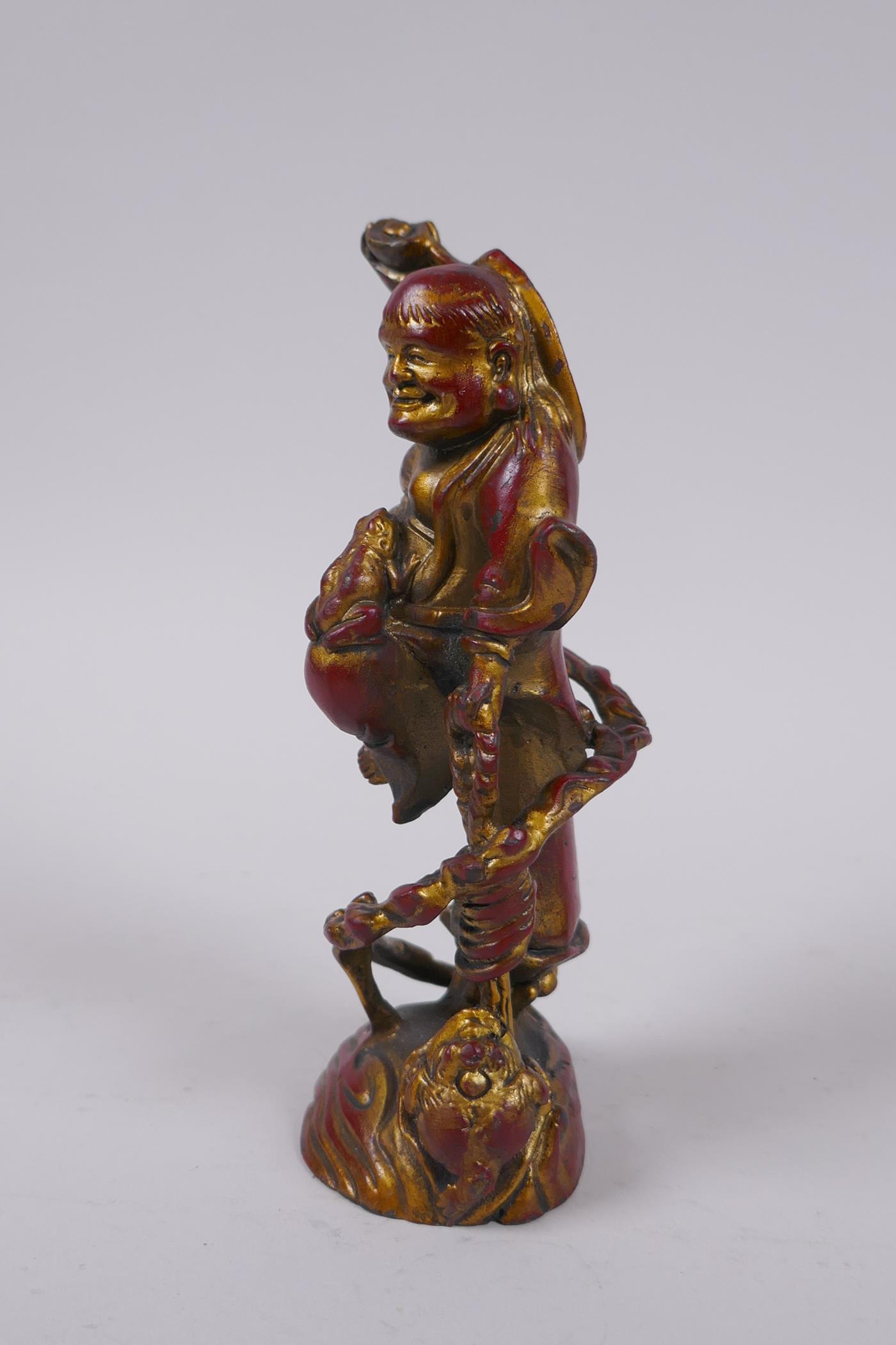 A Chinese gilt and coppered bronze Lohan and toads, 16cm high - Image 2 of 4