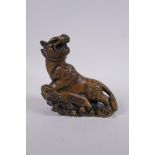 A Chinese bronze figure of a prowling tiger, 4 character inscription to side, impressed Xuande 6