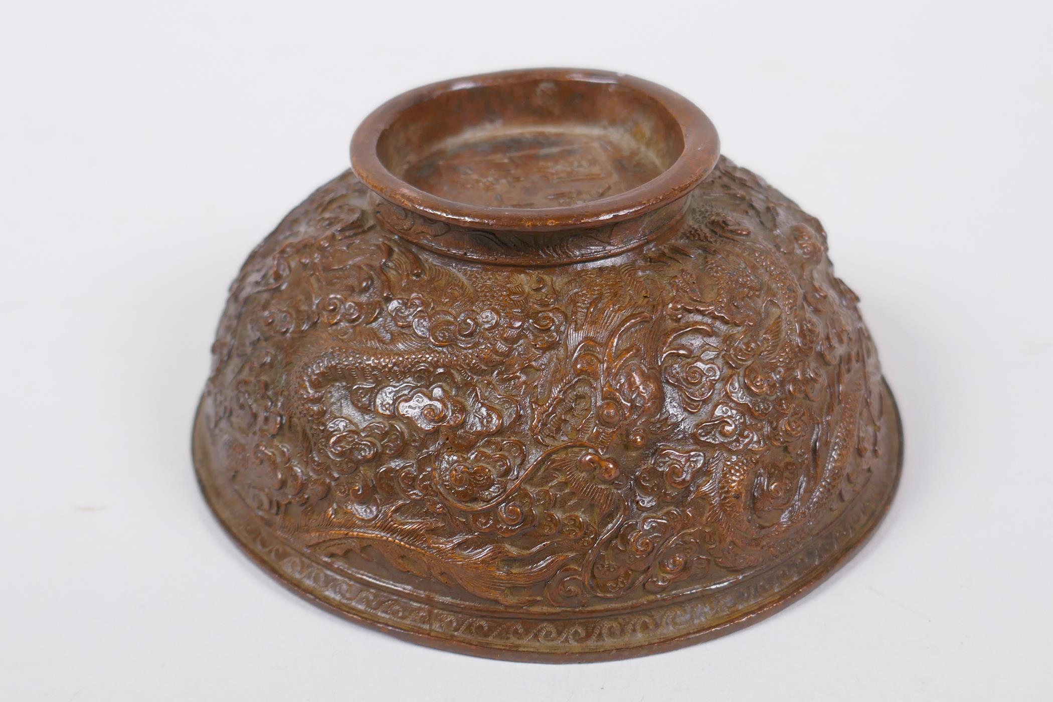 A Chinese bronze trinket bowl with raised dragon decoration, Qianlong 4 character mark to base, 11cm - Image 5 of 7