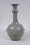 A Chinese celadon crackle glazed porcelain vase with a ringed neck and lion mask decoration