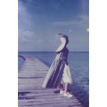 A fashion photograph of a woman on a quay, attributed to Barry Lategan verso, 20 x 29cm