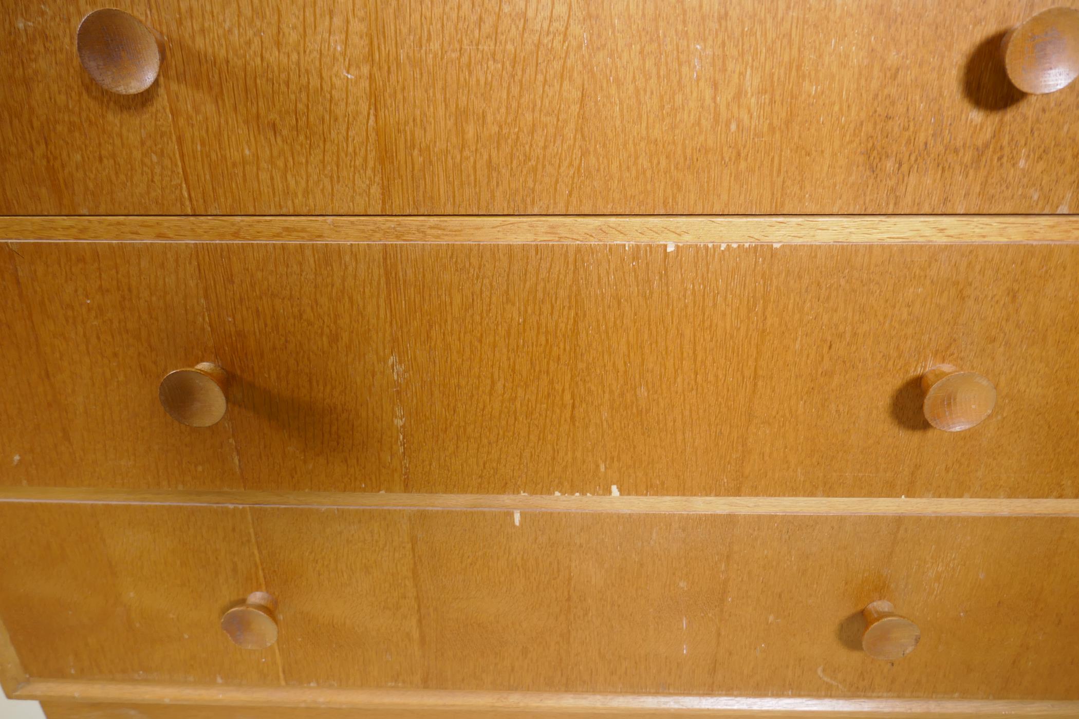 A mid century Meredew oak veneered chest of two over three drawers, raised on a plinth base, AF some - Image 6 of 6