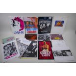 A collection of film programs, promotional books and film stills photographs, including Wall Street,