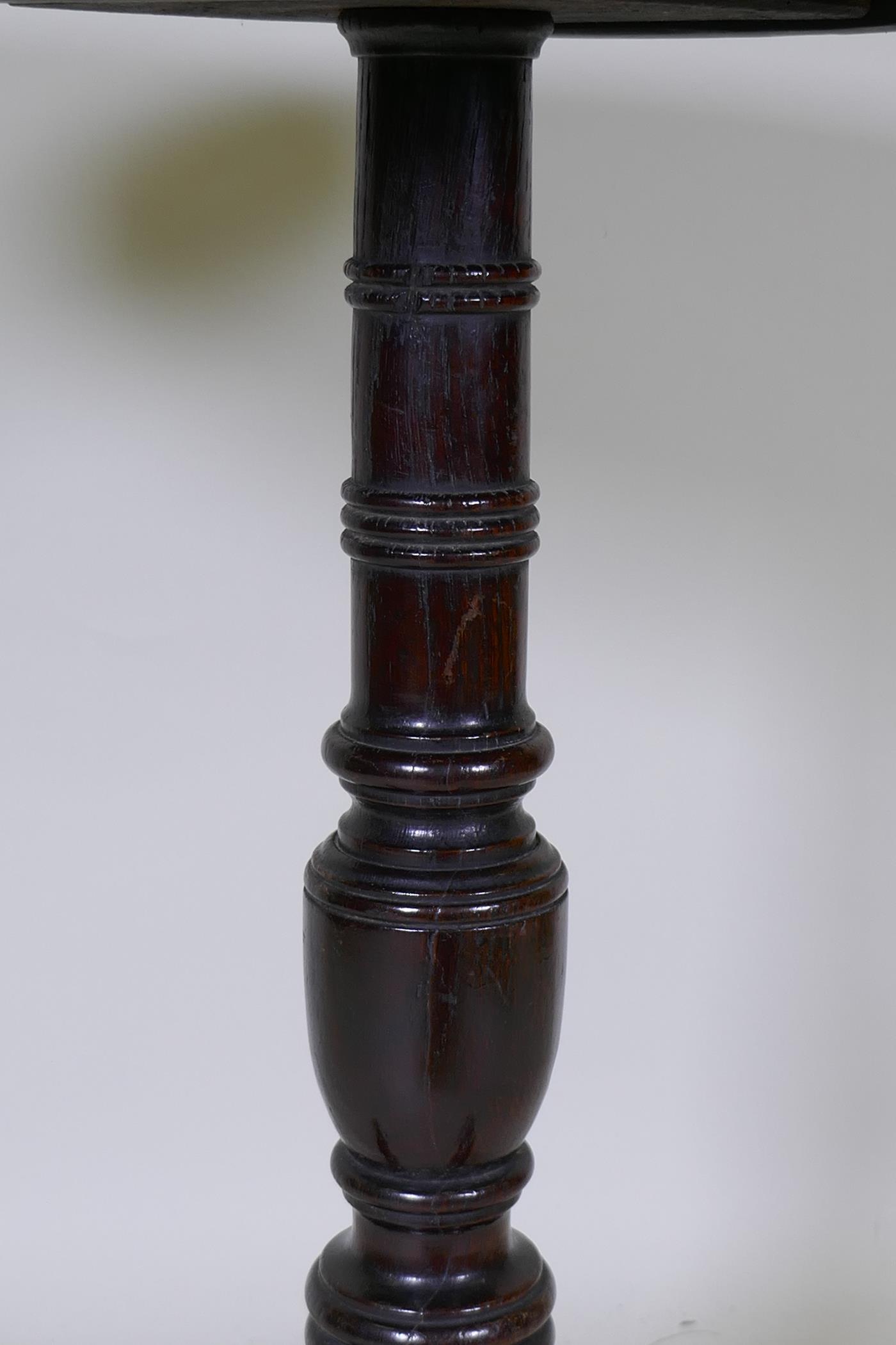 A Georgian tilt top oak table, raised on a canon barrel turned column with tripod supports, adapted, - Image 4 of 5
