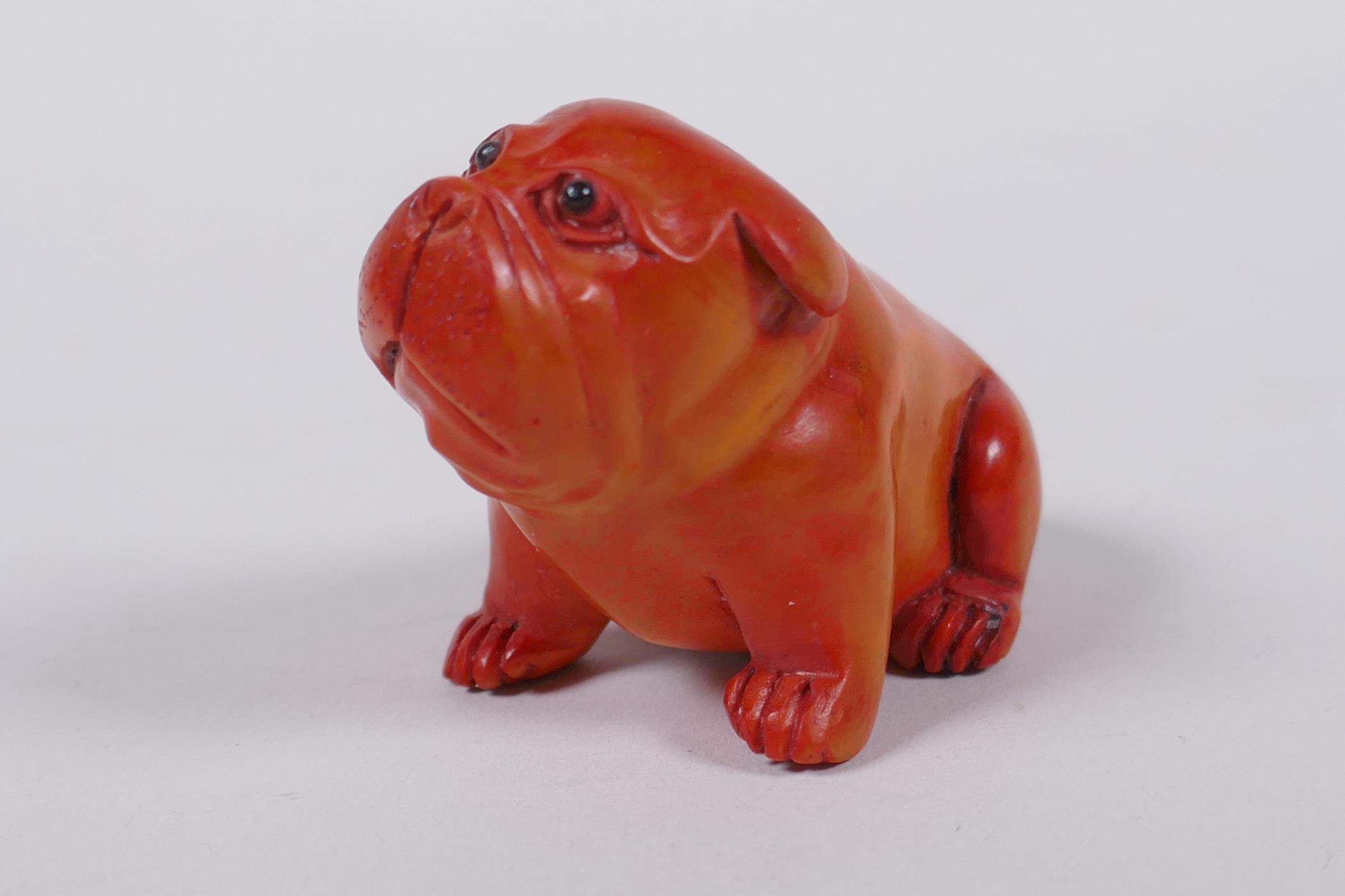 A Japanese carved boxwood netsuke in the form of a puppy, mark to base, 6cm long - Image 2 of 4