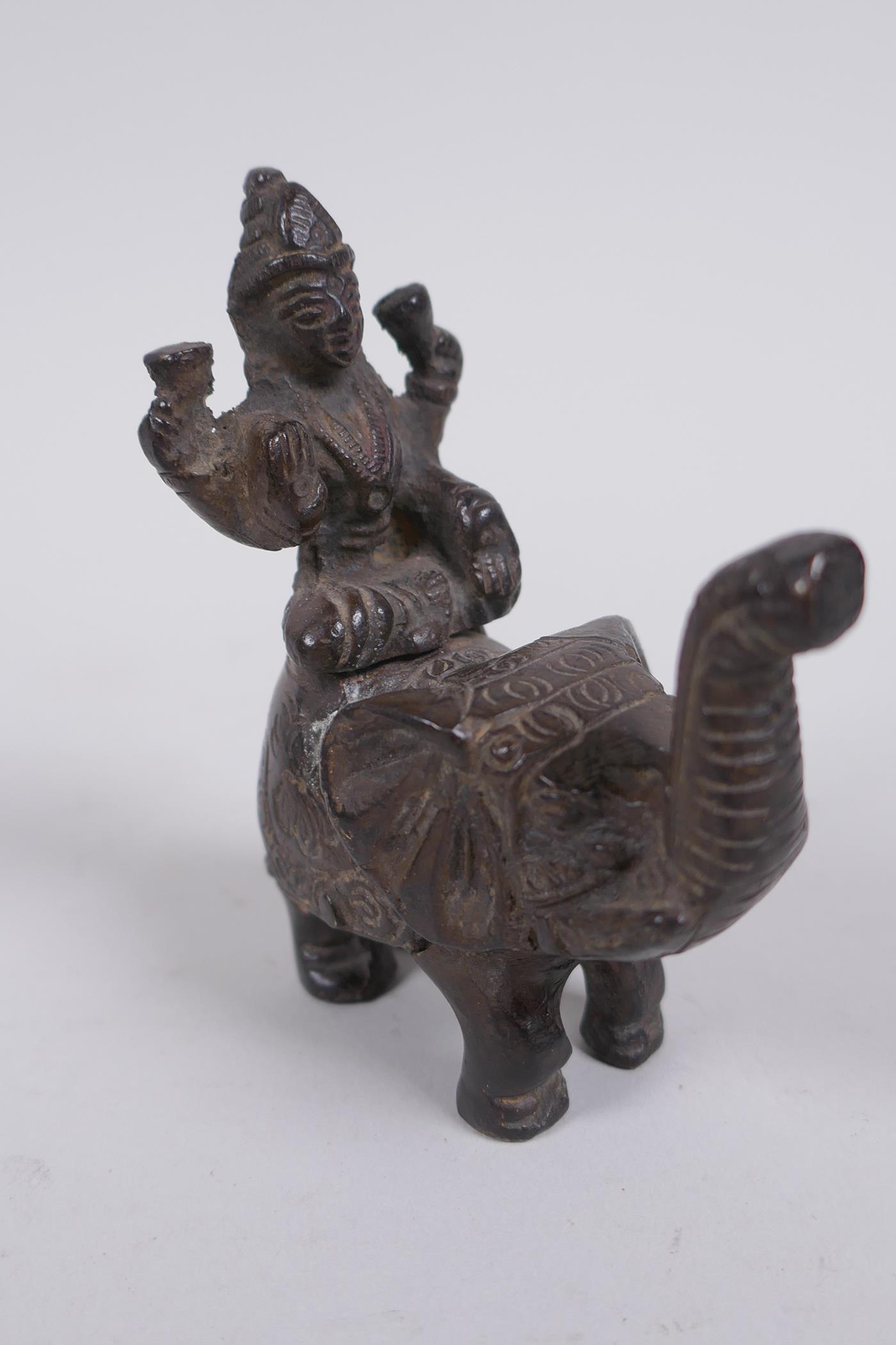 An Indian bronze figure of ganesh, and another Indian bronze figure of a deity riding an elephant, - Image 6 of 6