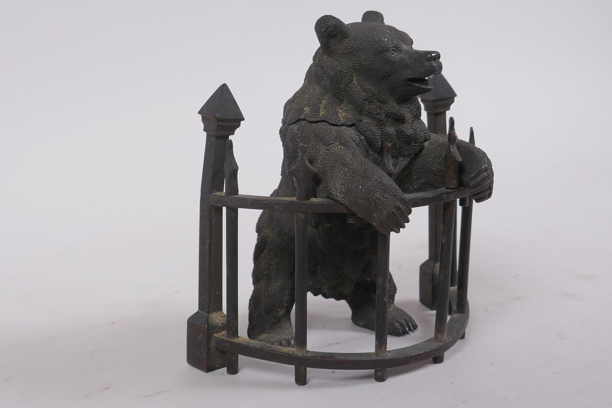 A C19th finely cast patinated bronze inkwell in the form of a bear behind railings, 12cm high - Image 2 of 7