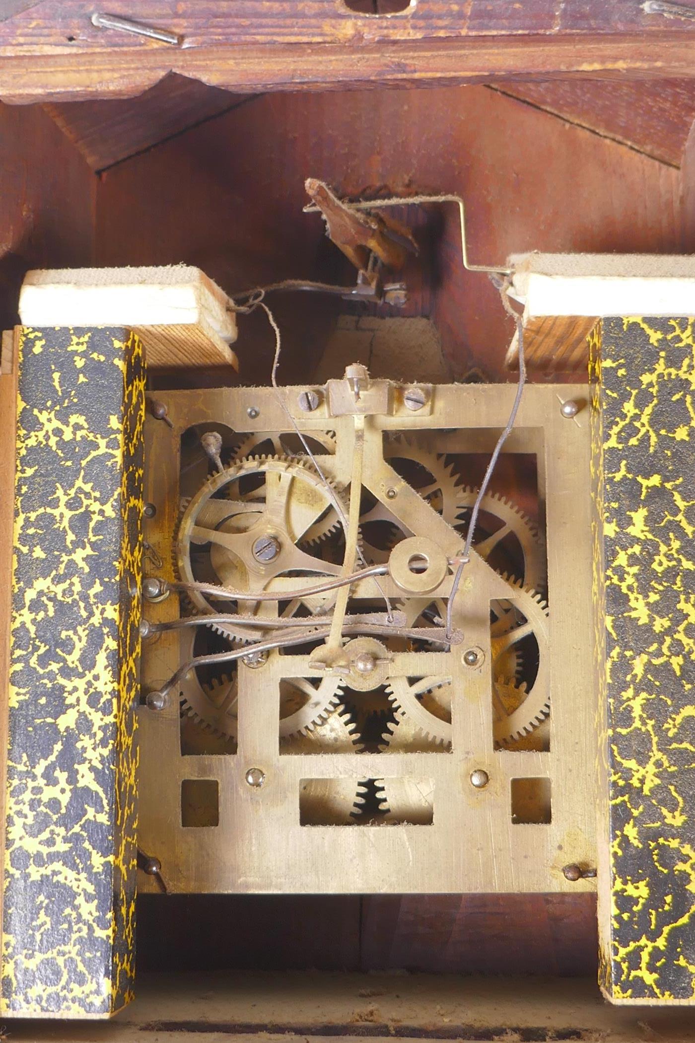 An antique carved Black Forest cuckoo clock, bellows intact, AF, 33 x 42cm - Image 6 of 7