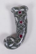 A Murghal style green hardstone dagger handle with overlaid white metal and red stone vine