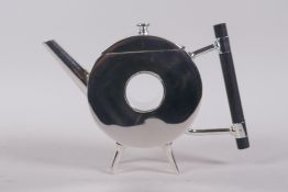 A Christopher Dresser style silver plate donut shaped teapot, 20cm long