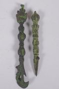 A Tibetan ornamental bronze phurba and a similar kartika, longest 19cm