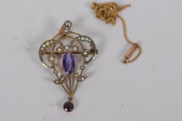 An Art Nouveau style 9ct gold pendant/brooch set with seed pearls and amethyst, 4cm long, and a