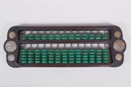 A Chinese hardwood and malachite style stone abacus inset with white metal tokens, 41 x 15cm