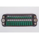 A Chinese hardwood and malachite style stone abacus inset with white metal tokens, 41 x 15cm