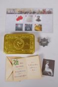 A WWI Queen Mary Christmas 1914 gift tin, with contents, cigarettes unopened, tobacco package (