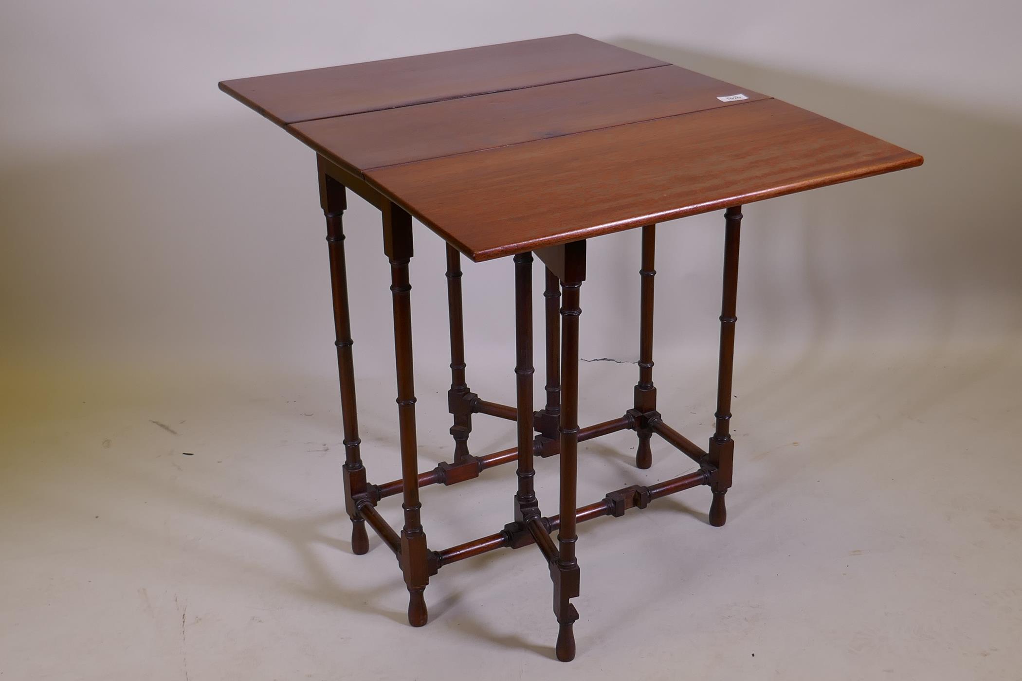 A Victorian mahogany spider gateleg table on ring turned supports, 61 x 26cm, 66cm high, 61 x 78cm - Image 2 of 3